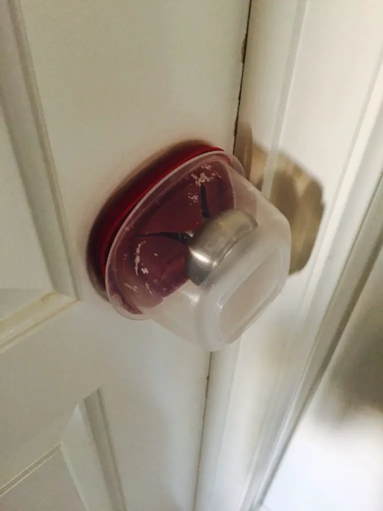 Doorknob with tupperware container around it