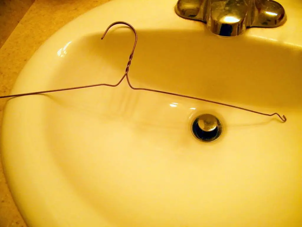clothes hanger to clean out drains