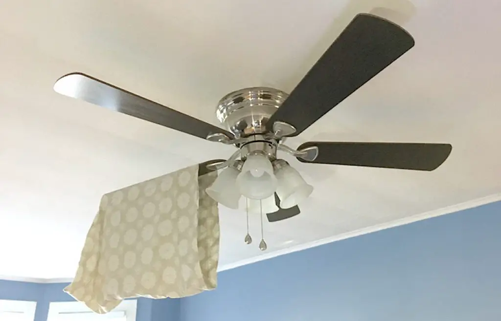 clean ceiling fan blades with a pillowcase