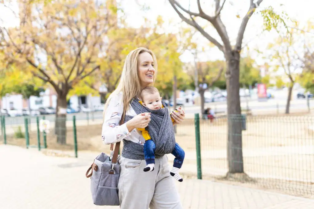 mom walking with baby in carrier